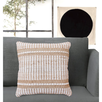 Textured throw pillow on a gray sofa with a neutral wall in the background