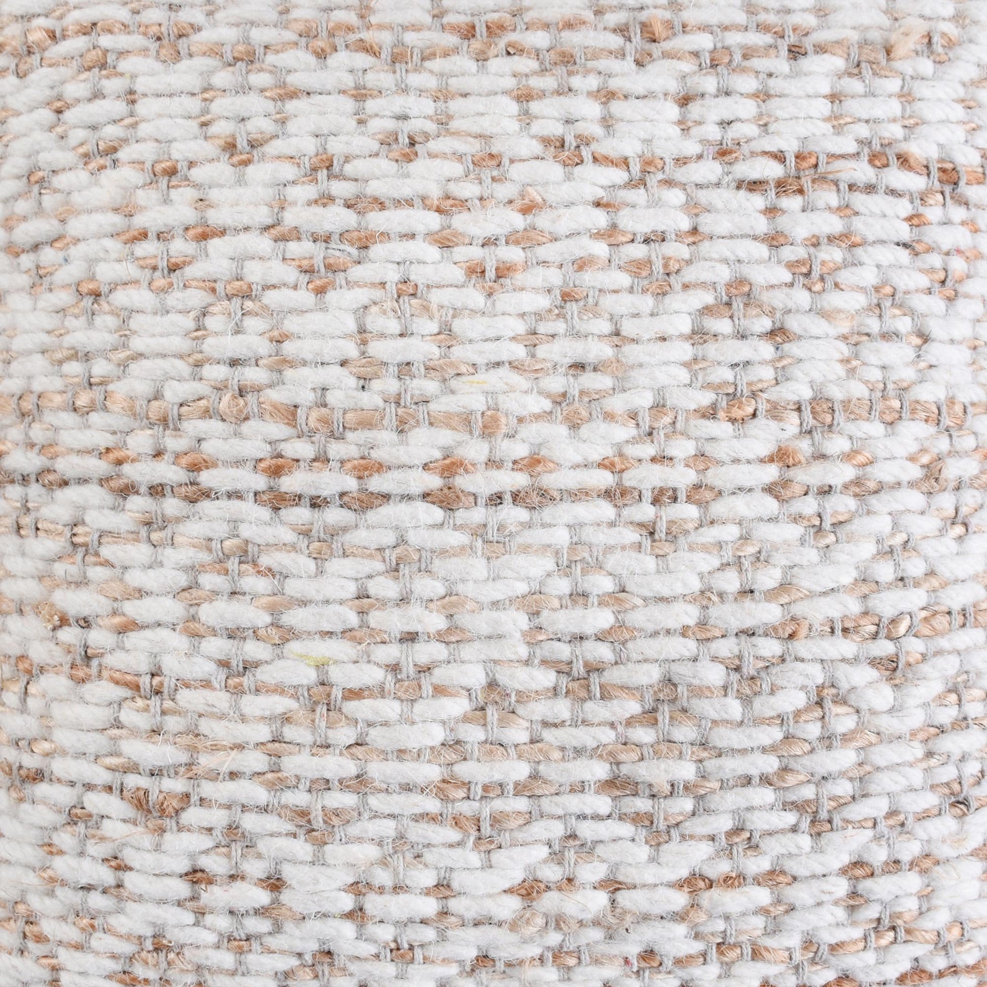 Close-up of a textured fabric with a neutral color palette