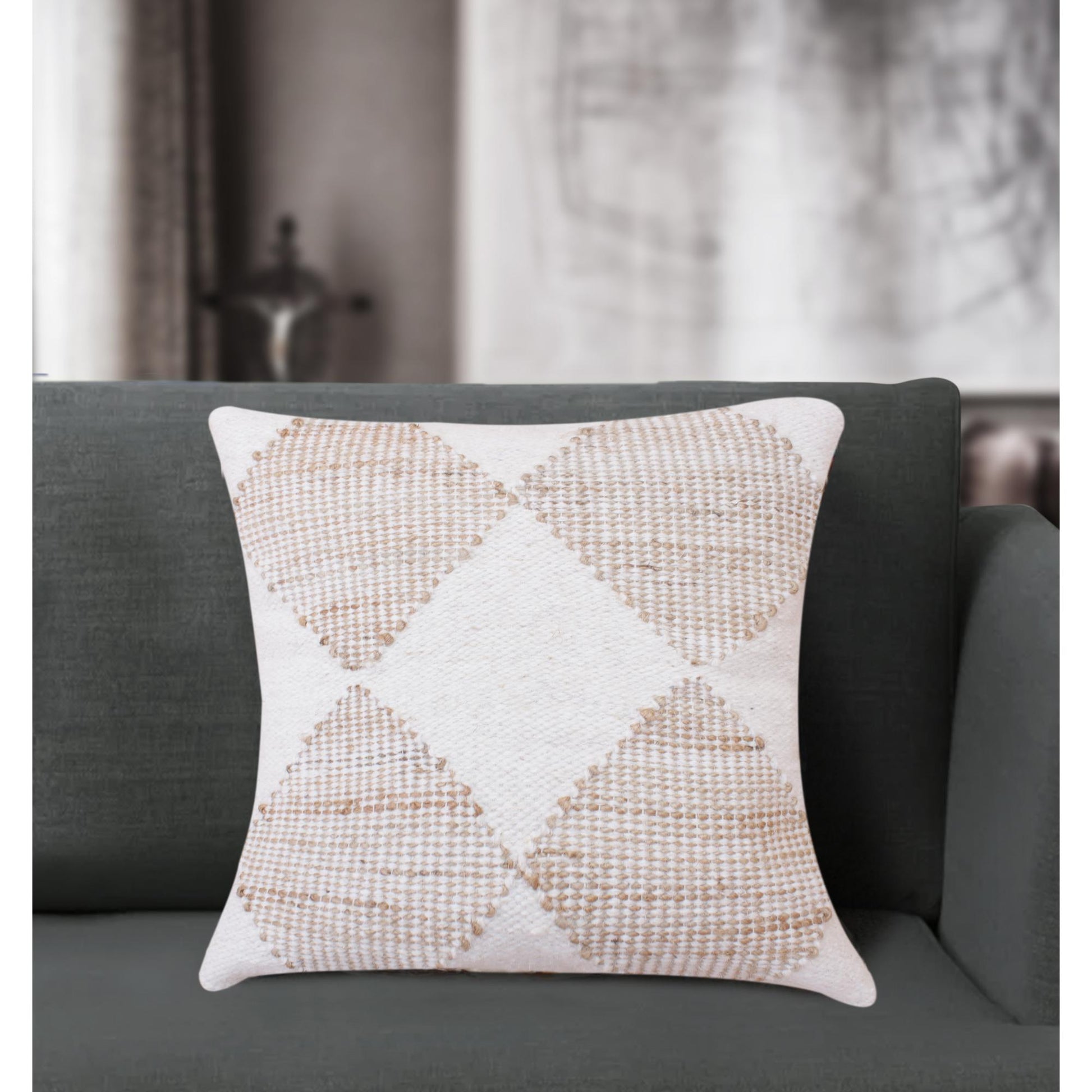 Hand woven jute and wool cushion with ivory and natural diamond pattern.