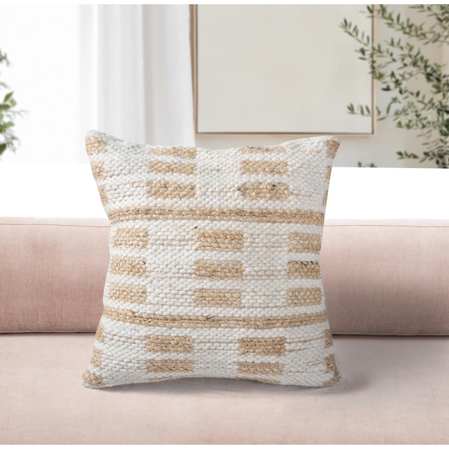Textured throw pillow on a couch with a neutral color scheme